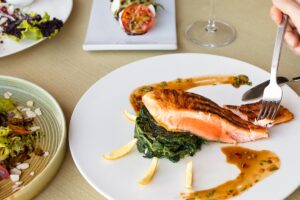 cooked fish on white ceramic plate